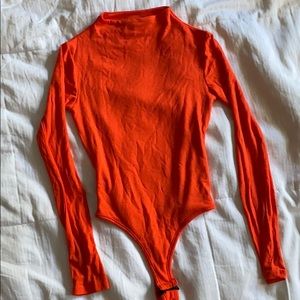 Naked wardrobe neon orange bodysuit